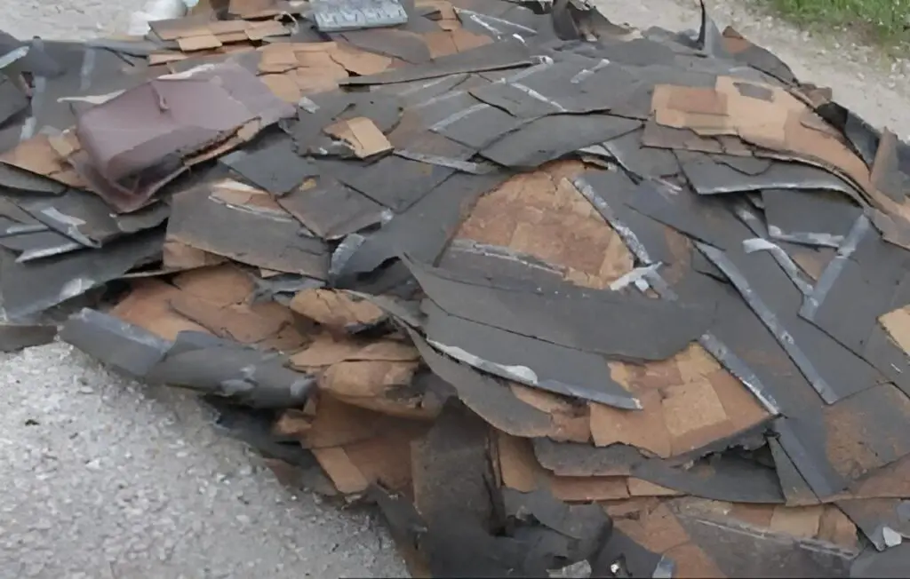 pile of old roofing shingles