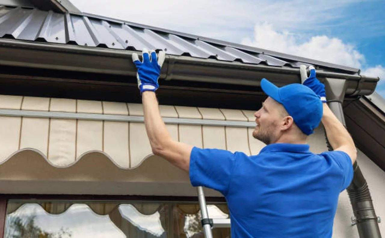 hanging gutters on a metal roof